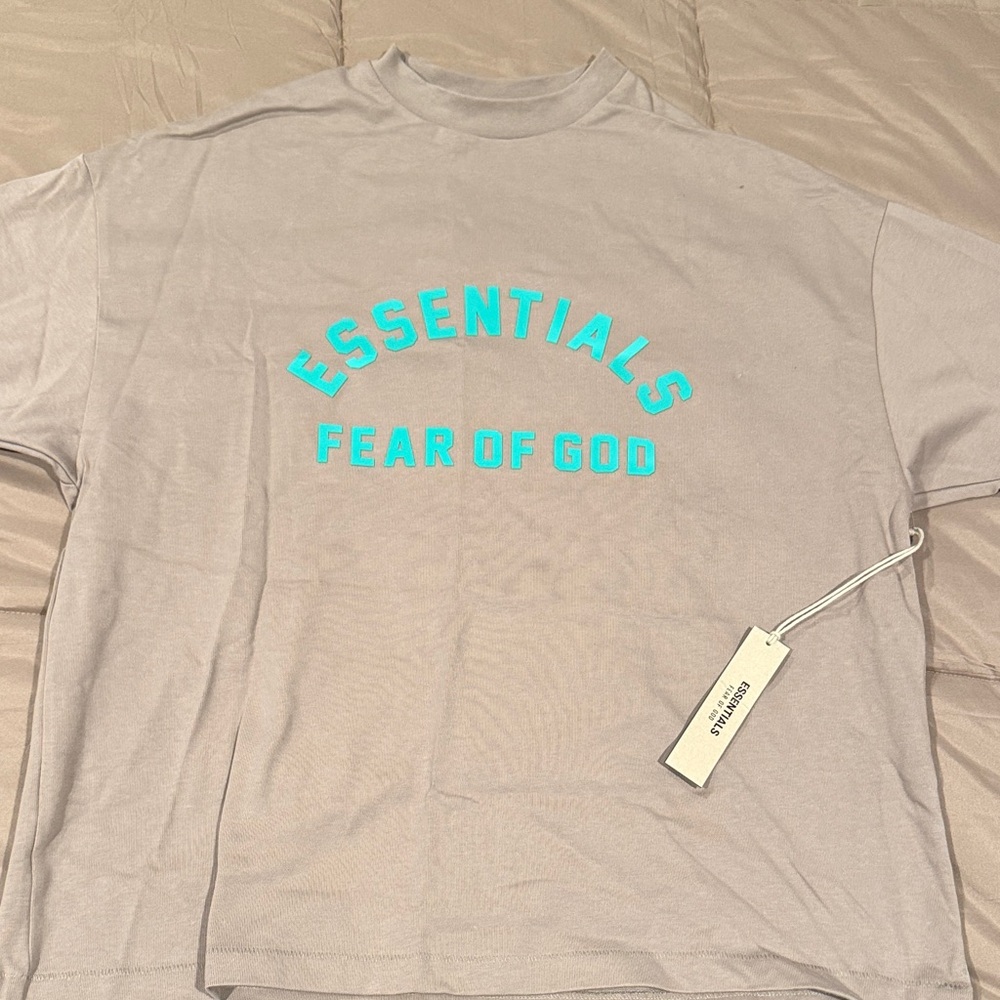 Fear of God Essentials Light Tan Tee with Aqua Text